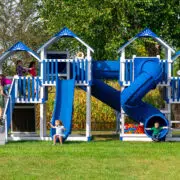 This image shows a massive blue playground with lots of slides