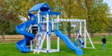 This image shows a blue Captain's Castle Swing Set from King Swings.