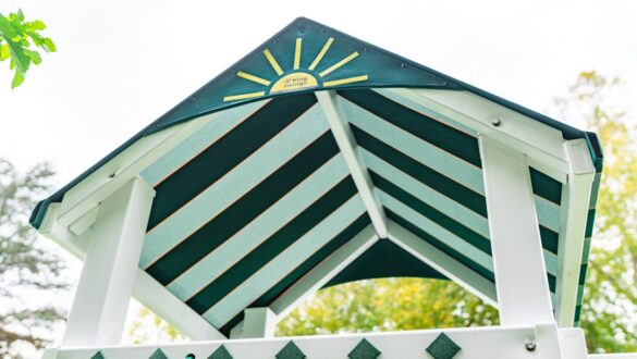 A fabric roof on the Care Bear Castle swing set.
