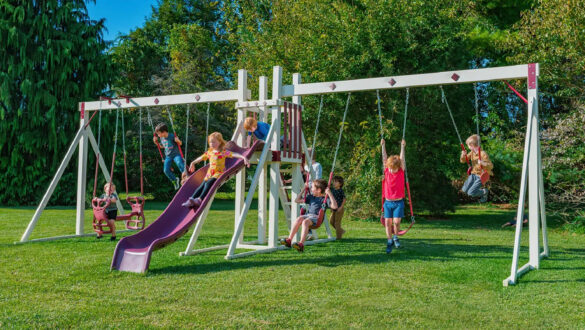 This image shows children playing on a swing set