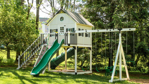 This image shows an ivory and green playhouse from King Swings