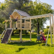 a swing set on a grassy field