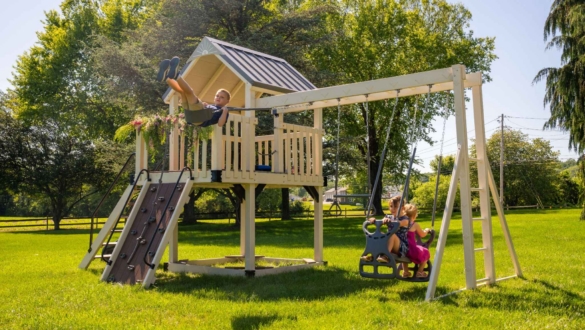 a swing set on a grassy field